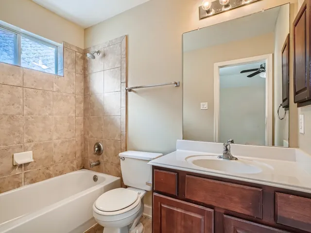 a bathroom with a sink toilet a bathtub and shower