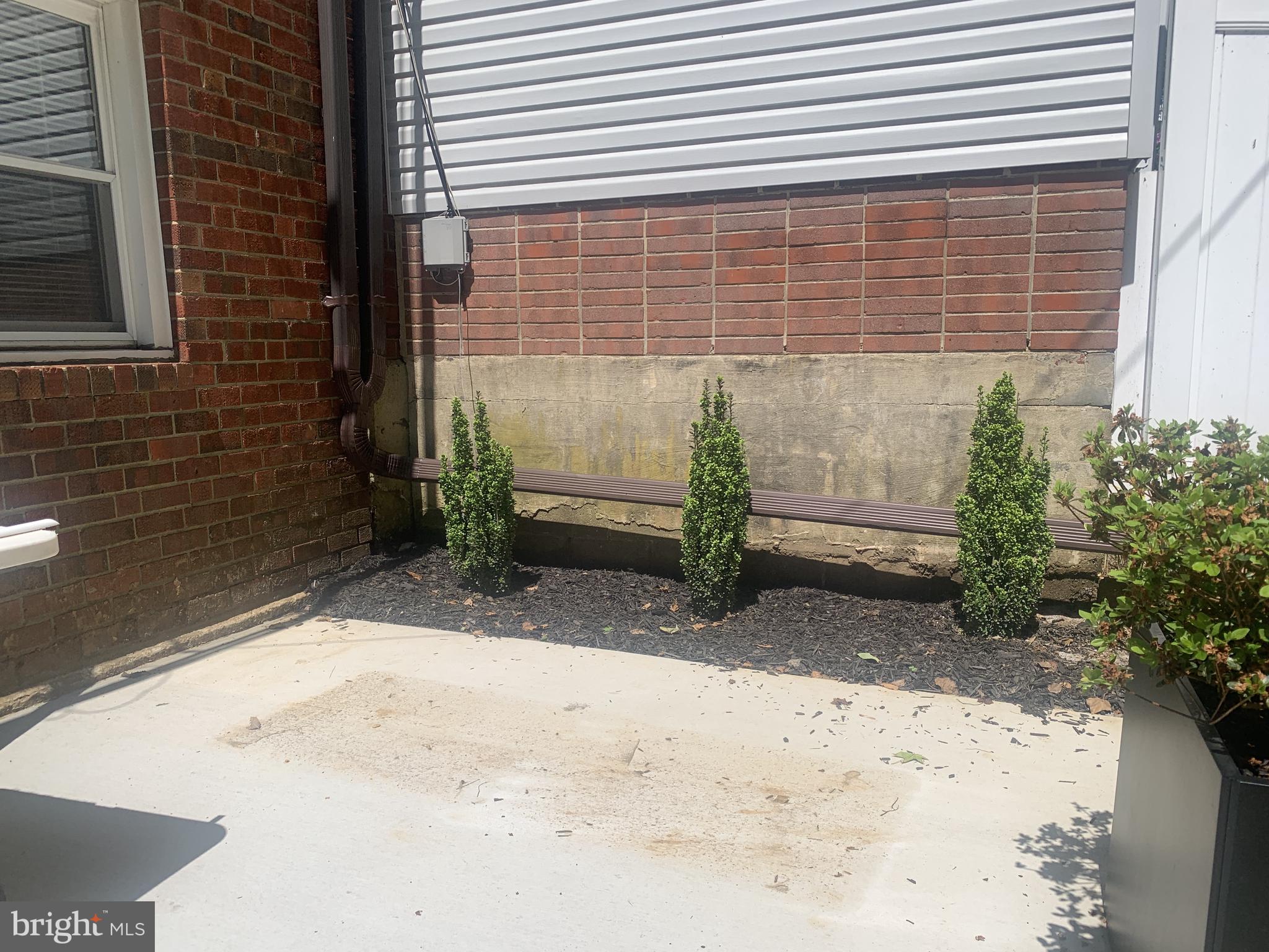 163 Wiltshire Road Claymont, DE 19703 - Photo 32 of 32 New patio with planters and outdoor furniture
