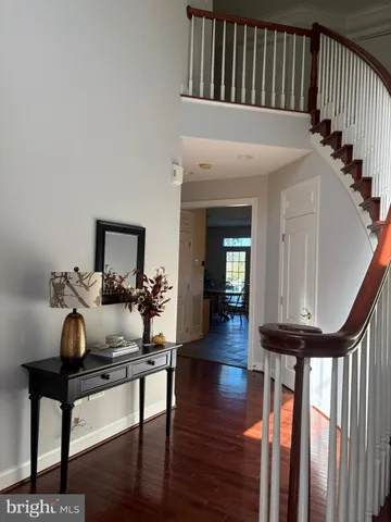 a view of a livingroom with furniture and hardwood floor