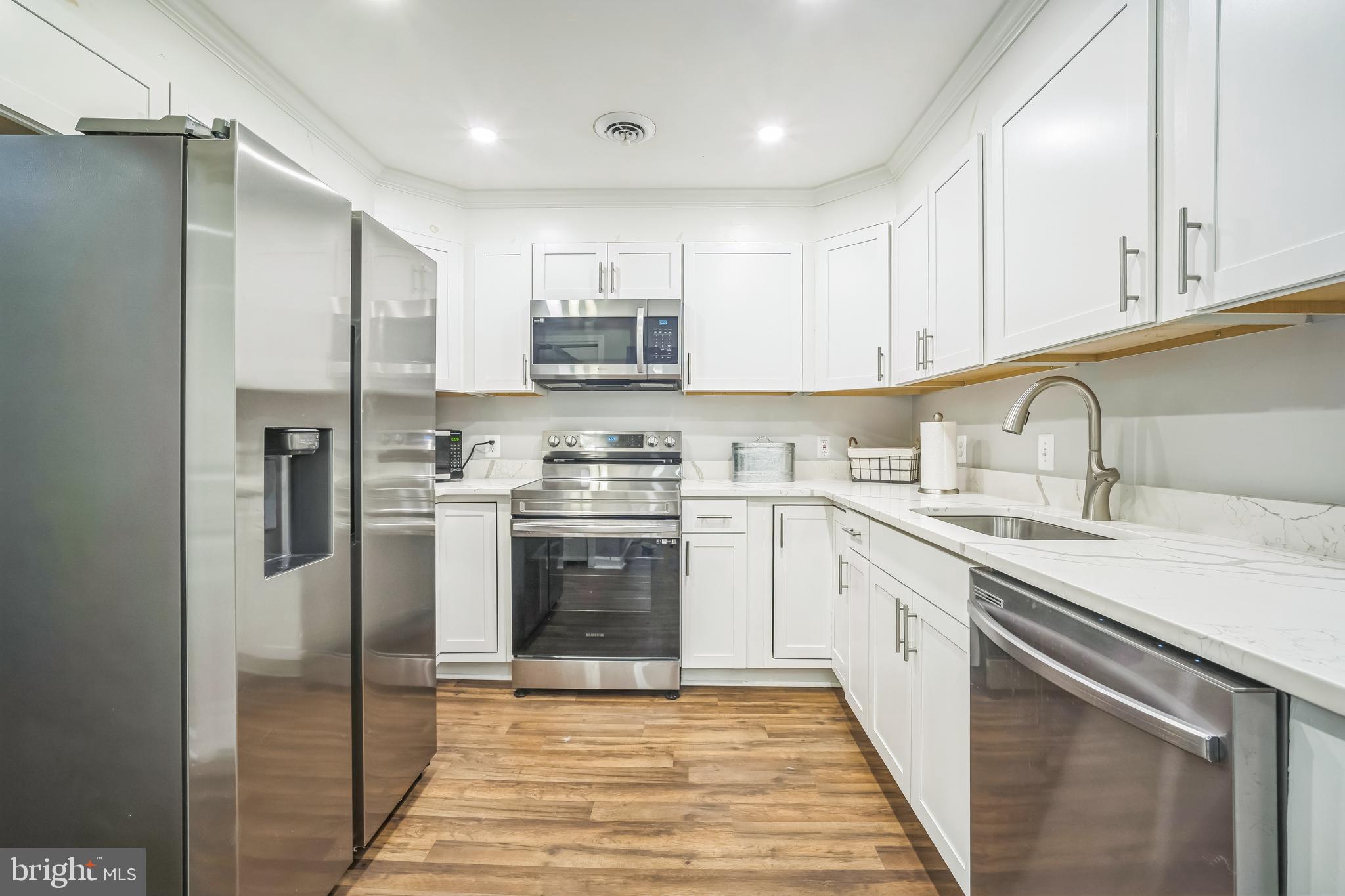 4183 Grant Lane The Plains, VA 20198 - Photo 11 of 29 a kitchen with stainless steel appliances granite countertop a refrigerator sink and stove
