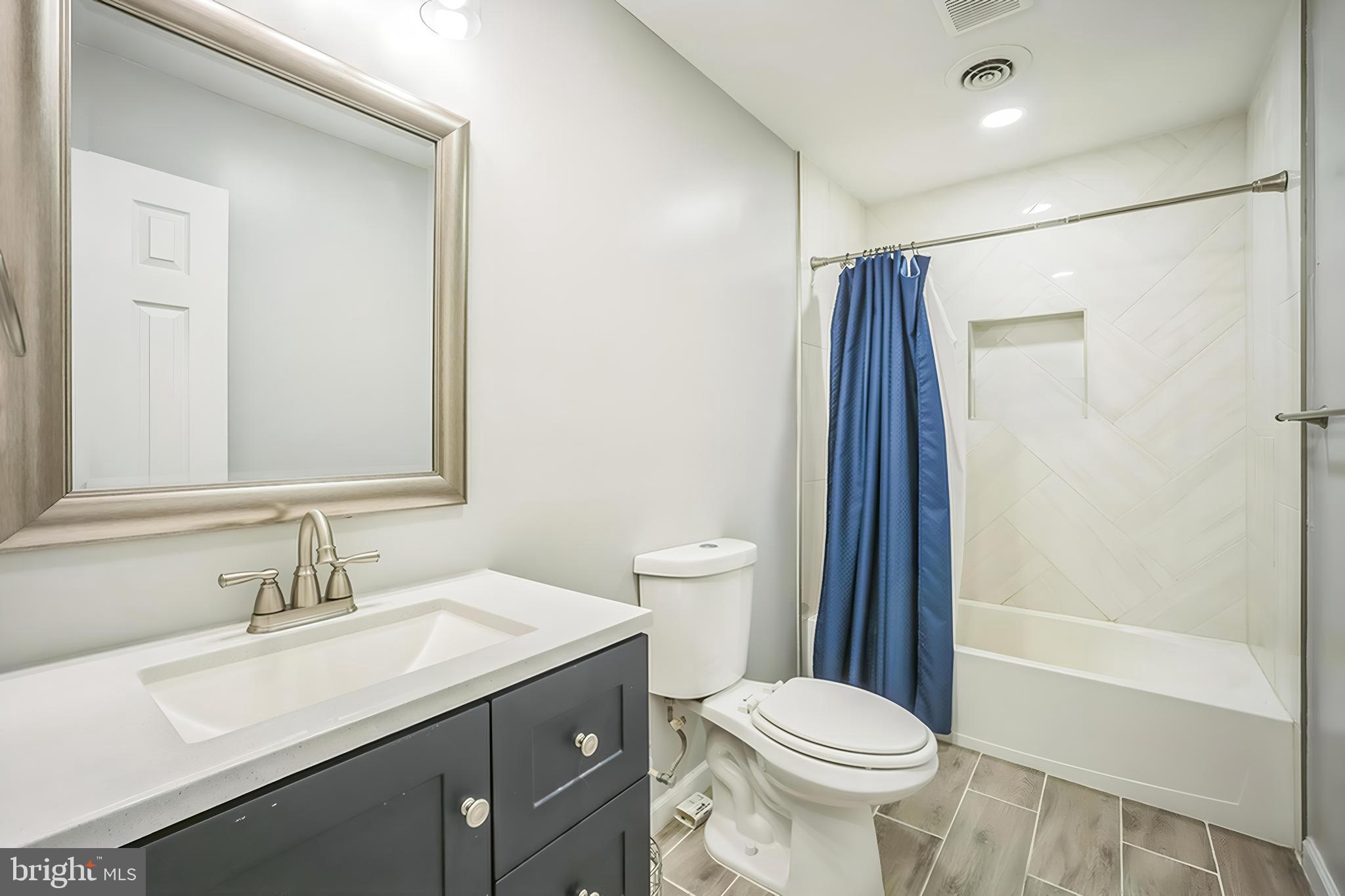 4183 Grant Lane The Plains, VA 20198 - Photo 23 of 29 a bathroom with a sink toilet and shower