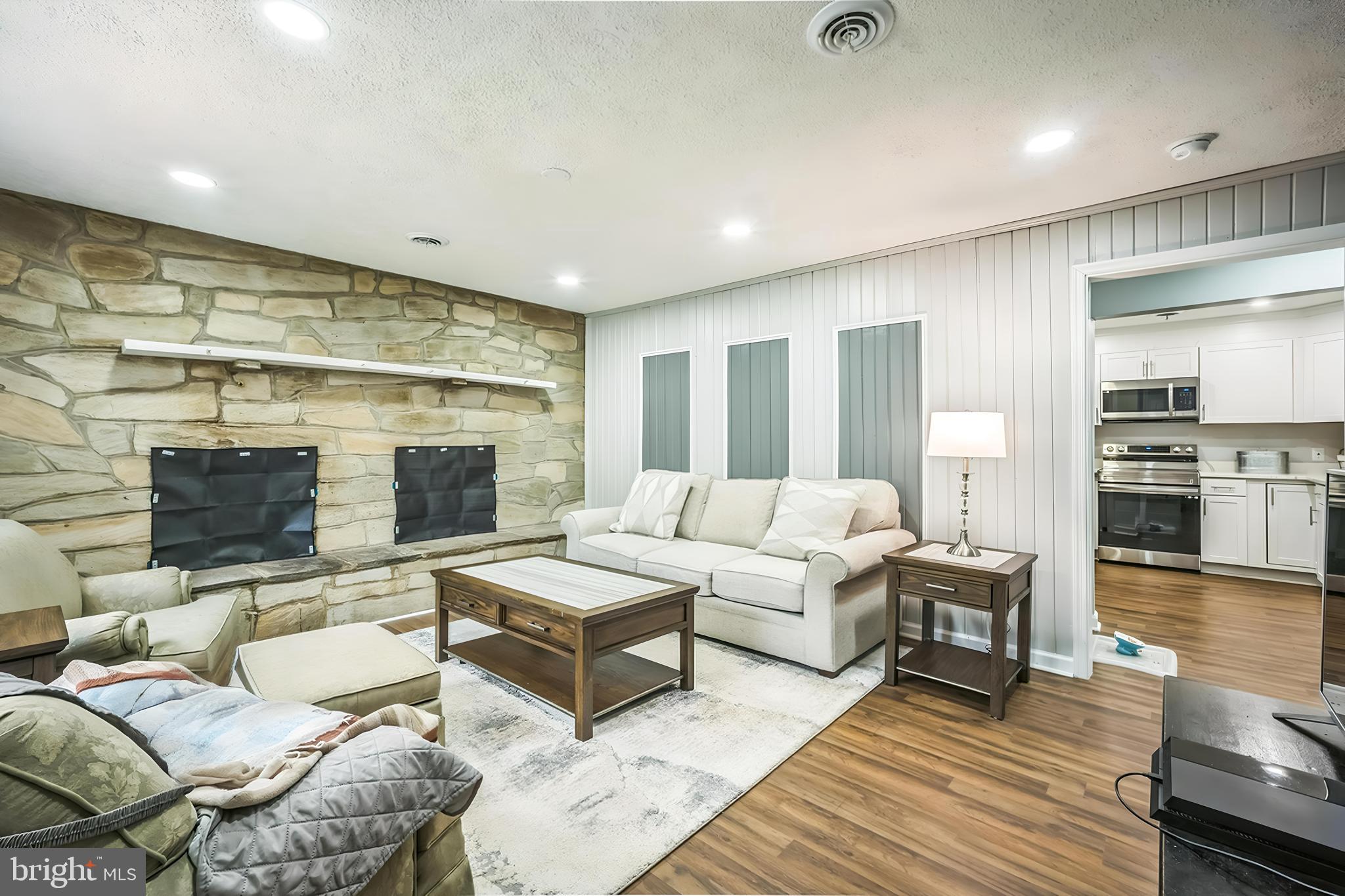 4183 Grant Lane The Plains, VA 20198 - Photo 8 of 29 a living room with furniture wooden floor and a flat screen tv