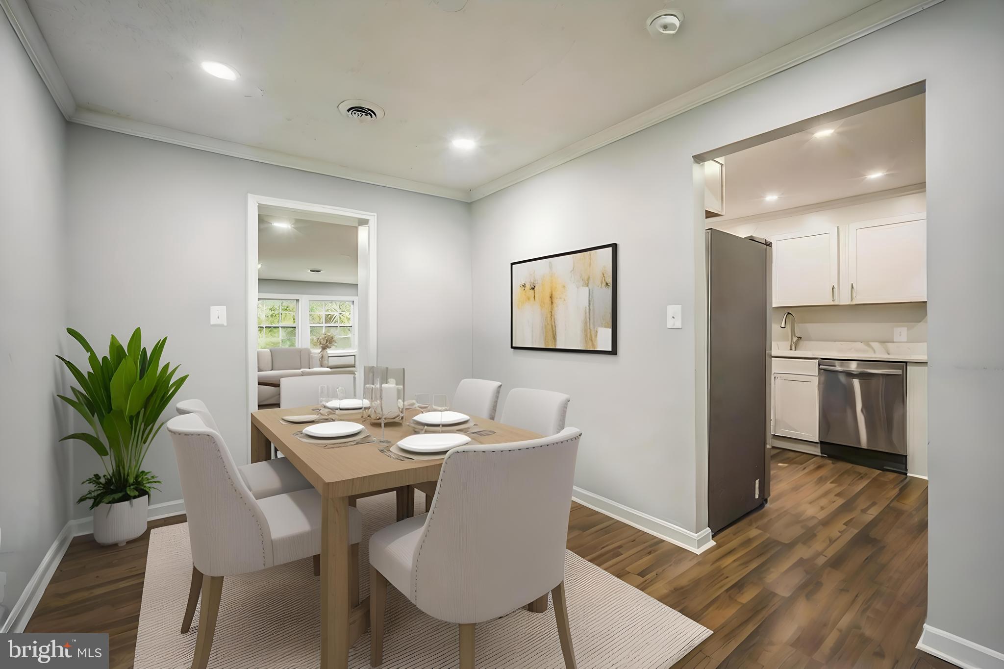 4183 Grant Lane The Plains, VA 20198 - Photo 9 of 29 a view of a dining room with furniture and a potted plant