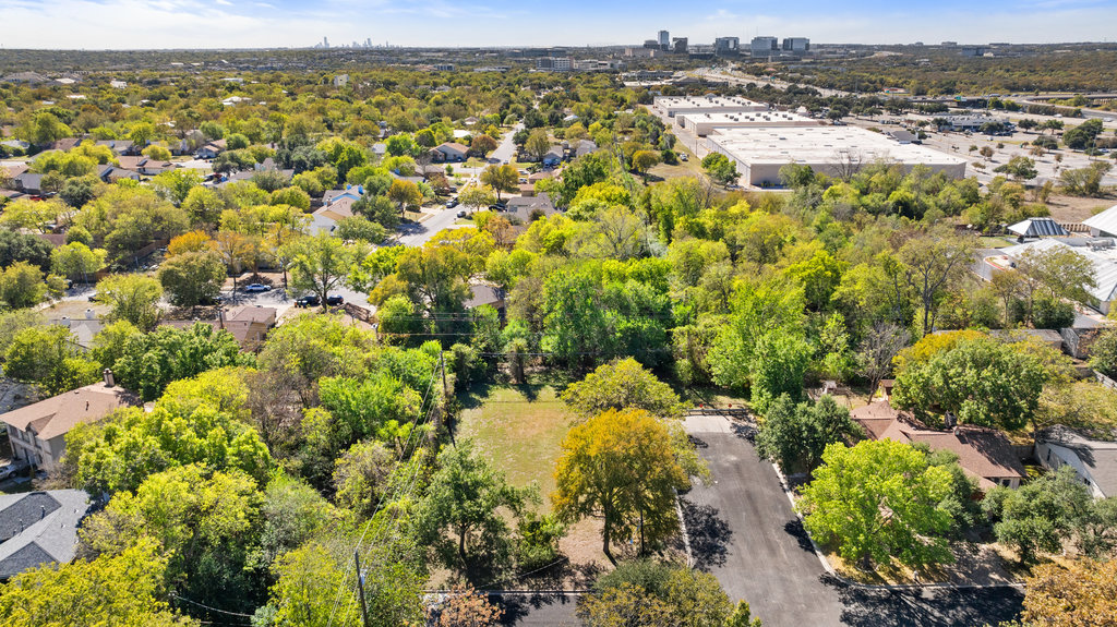 13003 Winwick Way Austin, TX 78727 - Photo 6 of 24 Drone / aerial view of a tree filled landscape