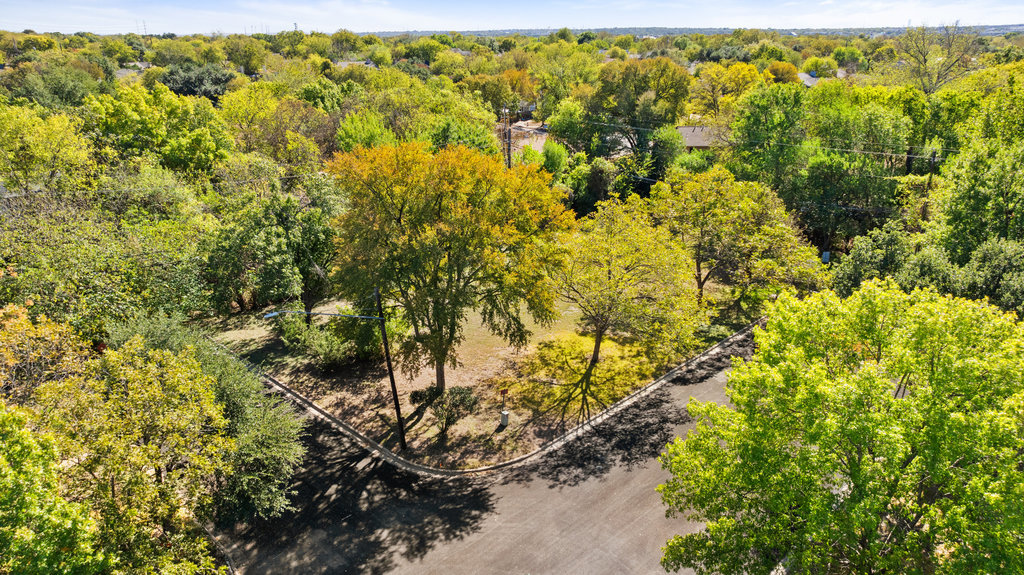 13003 Winwick Way Austin, TX 78727 - Photo 7 of 24 Aerial view of a heavily wooded area