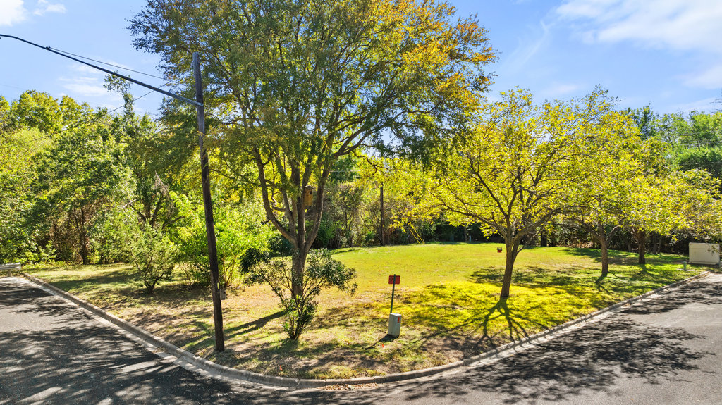 13003 Winwick Way Austin, TX 78727 - Photo 8 of 24 View of property's community featuring a lawn