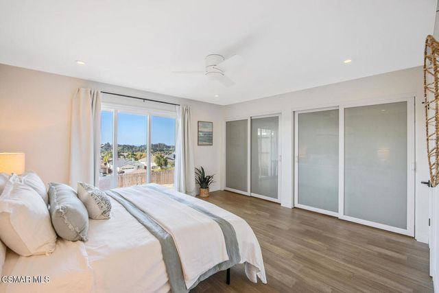 a view of a garden with a building in the background