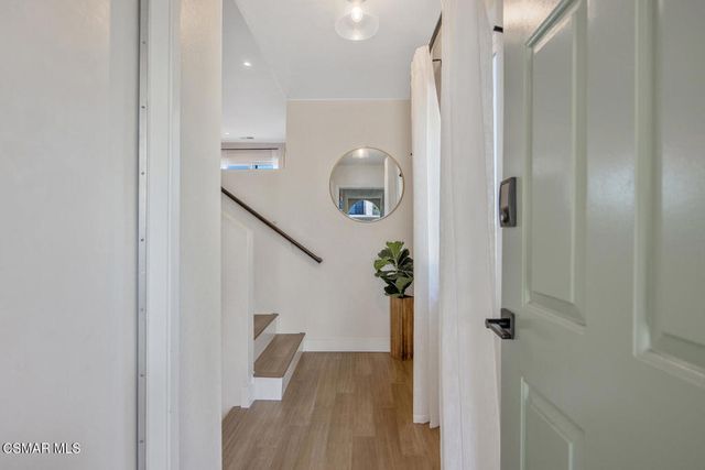 a view of a chairs and table in the patio
