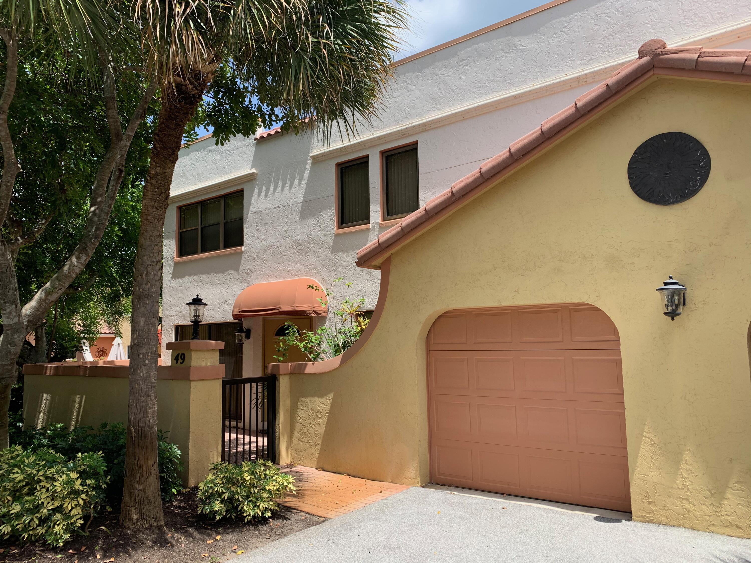 a front view of a house with yard