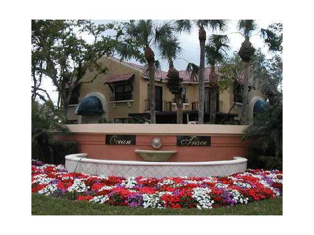 49 Uno Lago Drive Juno Beach, FL 33408 - Photo 18 of 18 a view of swimming pool with a house in the background