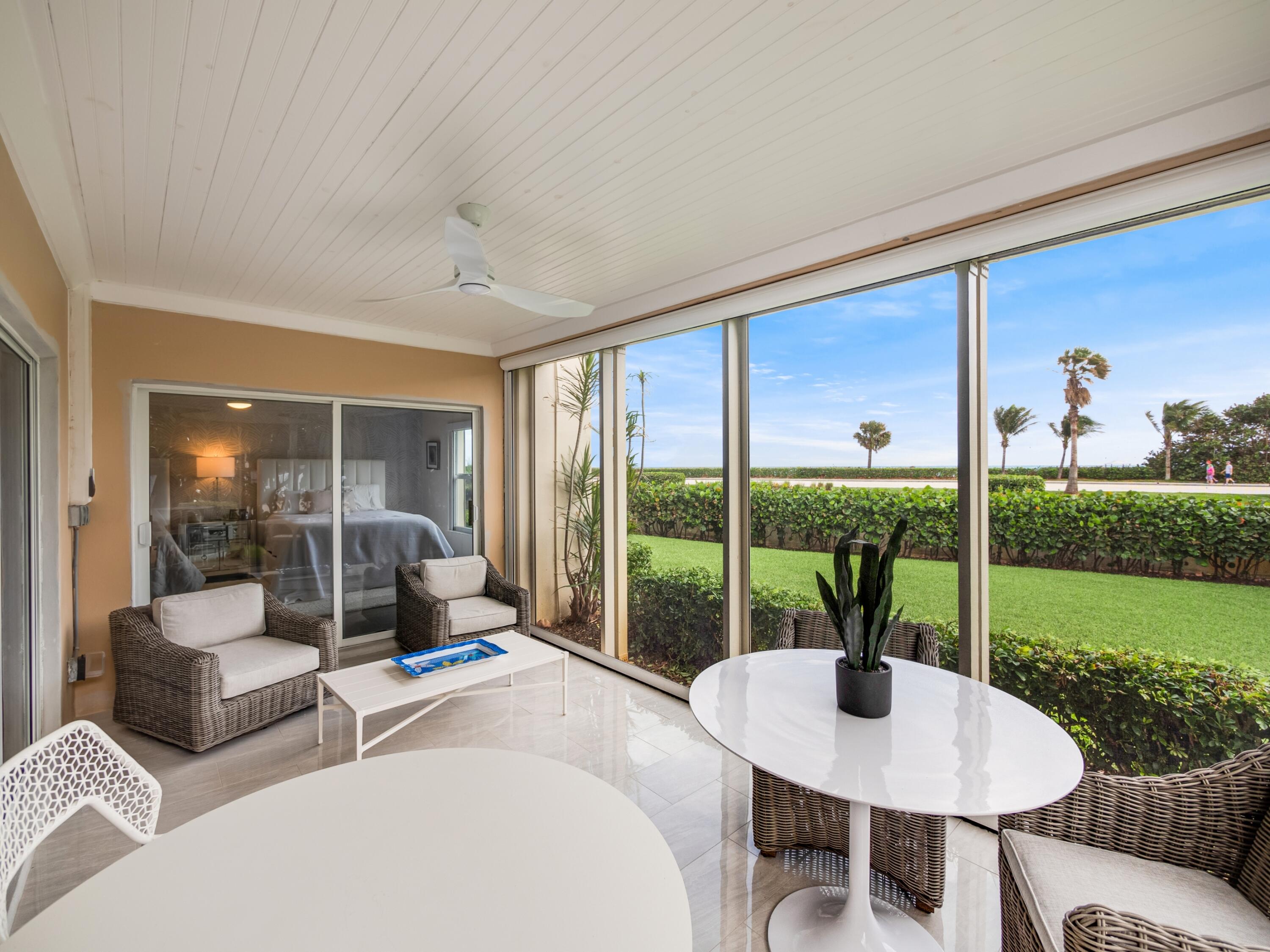 4161 U.S. Highway 1, Unit N1 Jupiter, FL 33477 - Photo 3 of 18 a living room with furniture and a garden