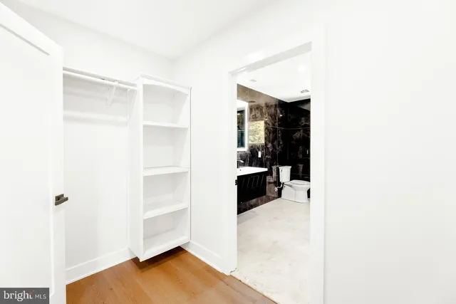 a view of a bedroom with closet