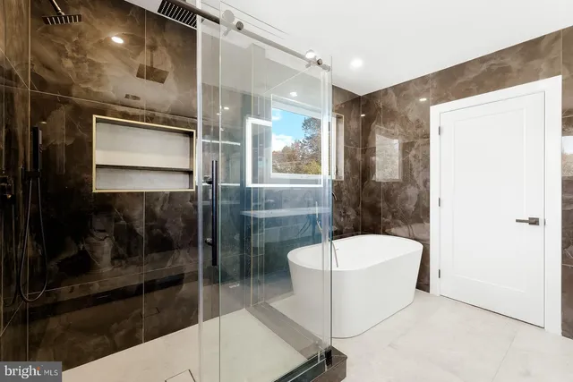 a bathroom with a shower and a toilet