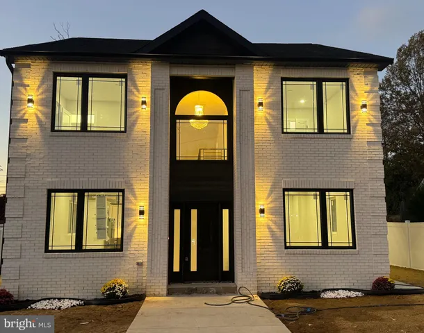 a front view of a house having a yard