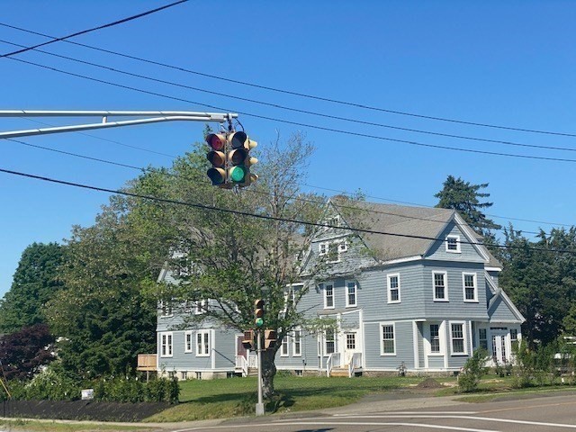 25 Ripley Road, Unit 1 Cohasset, MA 02025 - Photo 11 of 14 a view of a big house with a street