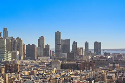 a view of city and a tall buildings
