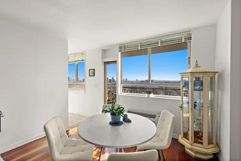 a kitchen with a table and chairs