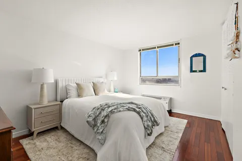 a bed room with a bed and a night lamp
