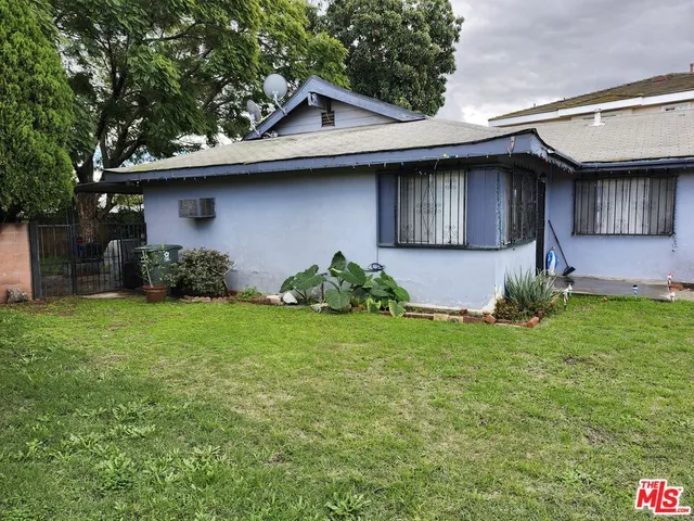 a house with a tree in front of it