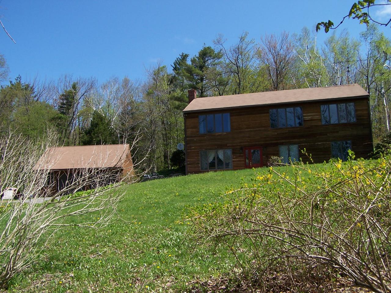 1330 Jacobs Ladder Road Becket, MA 01223 - Photo 1 of 15 a view of a house with a yard
