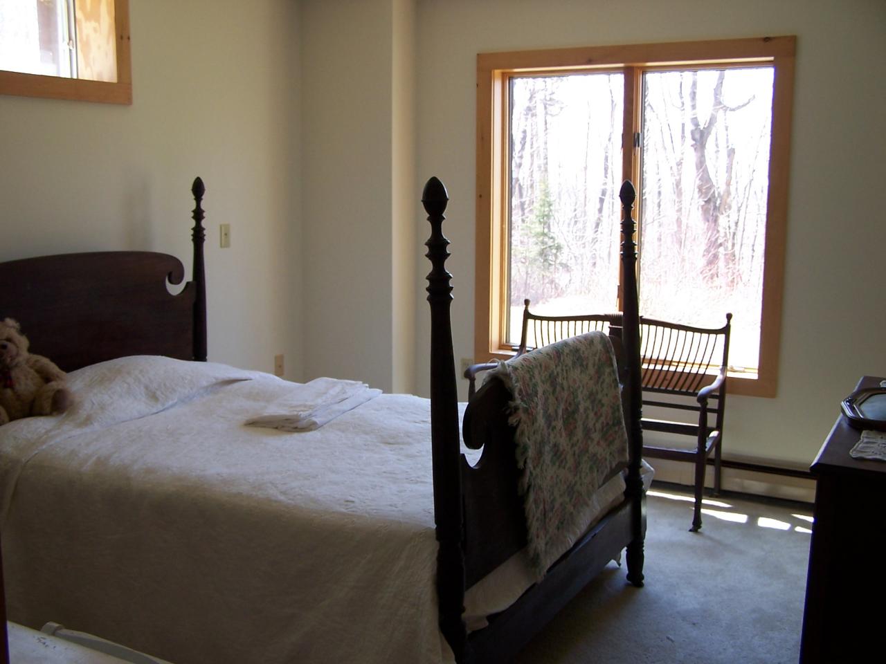 1330 Jacobs Ladder Road Becket, MA 01223 - Photo 10 of 15 a bedroom with a bed and a window