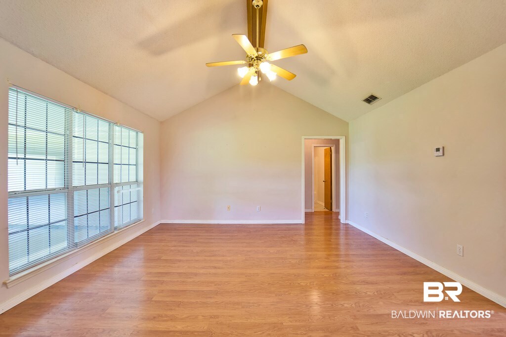 9385 Prairie Drive Semmes, AL 36575 - Photo 5 of 19 Large vaulted family room leads to back porch