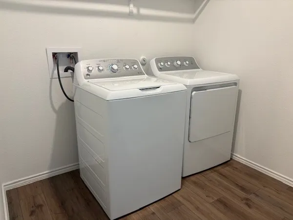 a utility room with dryer and washer