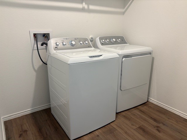 147 Gabbro Gardens Maxwell, TX 78656 - Photo 12 of 14 Dedicated laundry area featuring wood-finish flooring and white baseboards