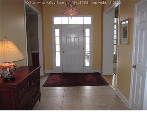 1582 Hampton Road Charleston, WV 25314 - Photo 2 of 8 Other. Stunning foyer with tile floors, large molding and spacous hallway. Maple hardwood floors throughout the rest of the house except for tile baths and carpet in the bonus room.