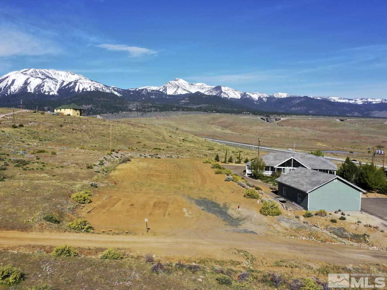 240 Willbuck Road Reno, NV 89521 - Photo 2 of 14 a view of a lake with a mountain in the background