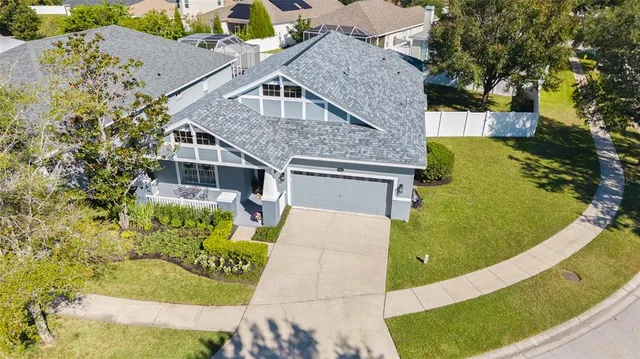 a aerial view of a house with a yard