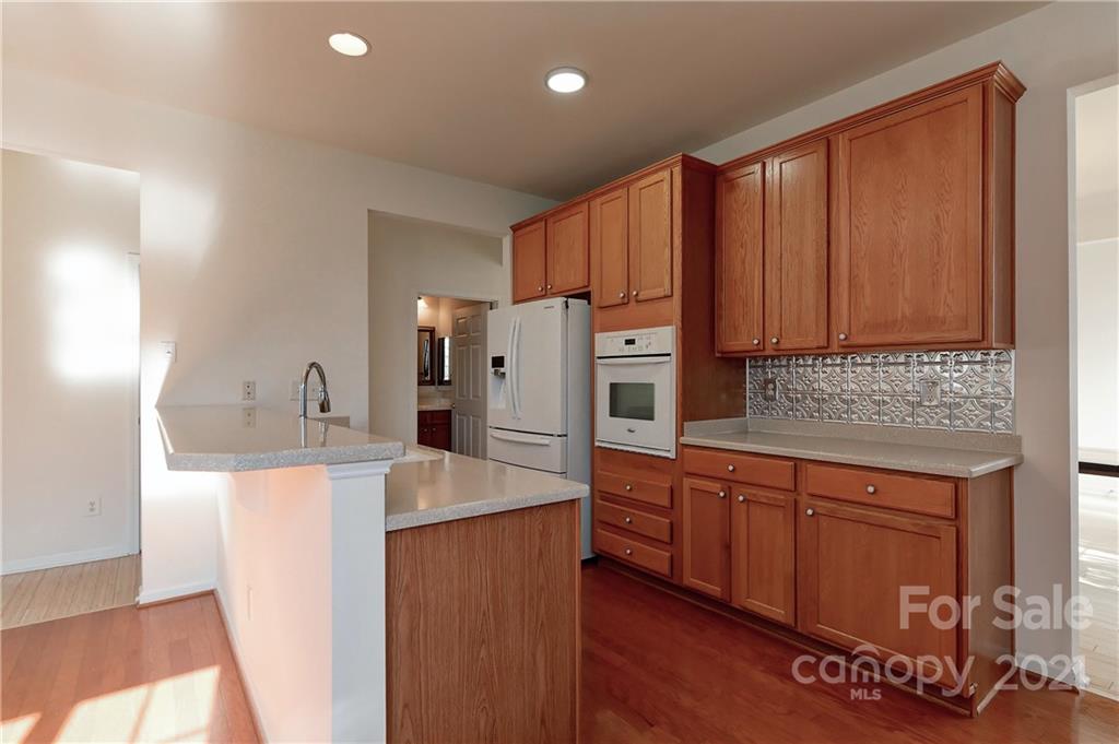 302 Garnet Court, Unit 522 Fort Mill, SC 29708 - Photo 11 of 45 a kitchen with stainless steel appliances granite countertop a refrigerator a sink and a stove