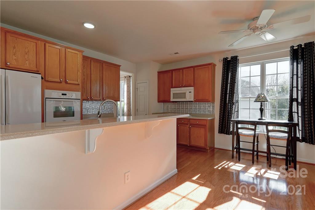 302 Garnet Court, Unit 522 Fort Mill, SC 29708 - Photo 15 of 45 a large kitchen with kitchen island a large window appliances and furniture
