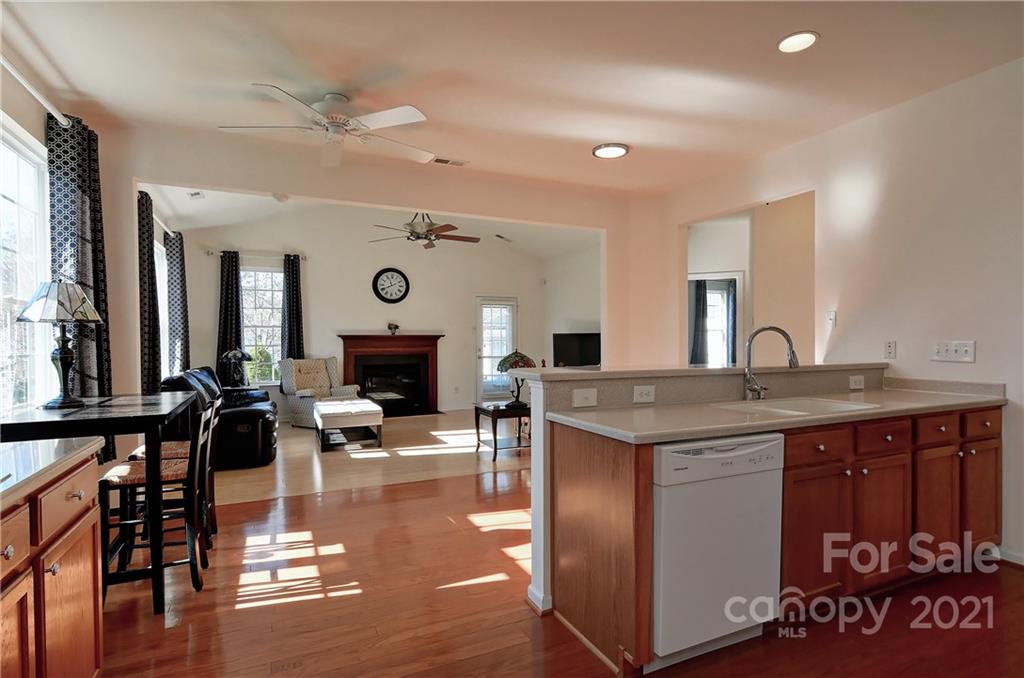 302 Garnet Court, Unit 522 Fort Mill, SC 29708 - Photo 16 of 45 a living room with furniture a fireplace and a large window