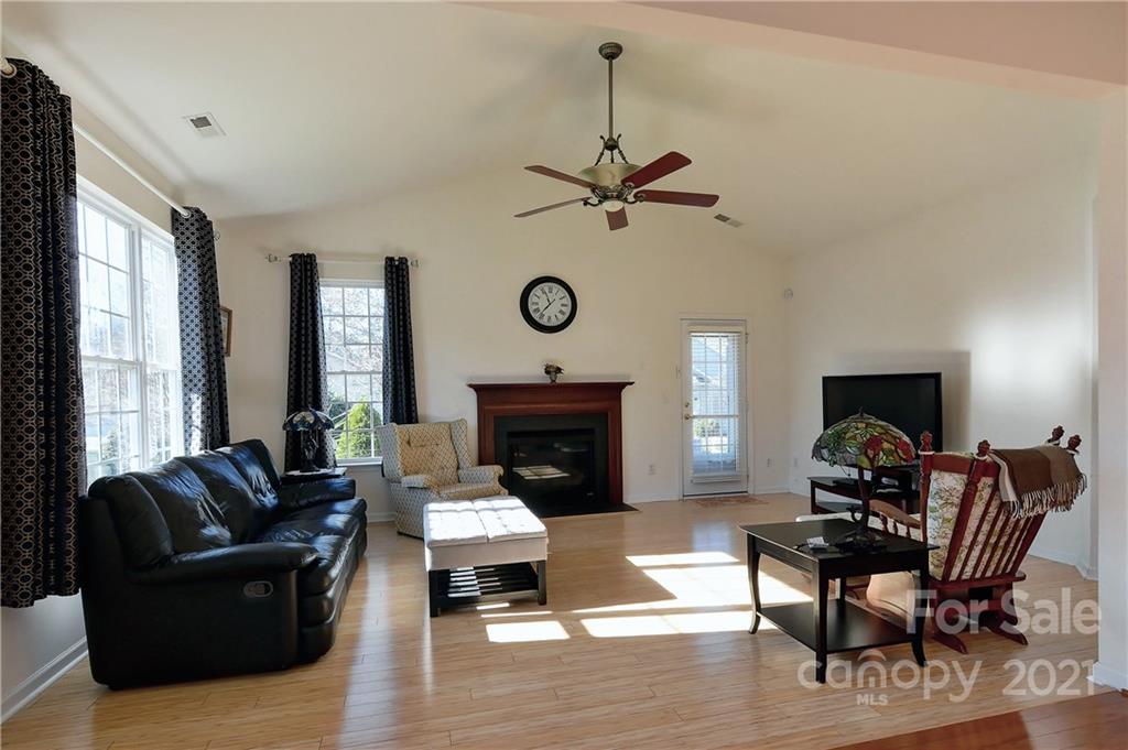 302 Garnet Court, Unit 522 Fort Mill, SC 29708 - Photo 18 of 45 a living room with furniture fireplace and a large window