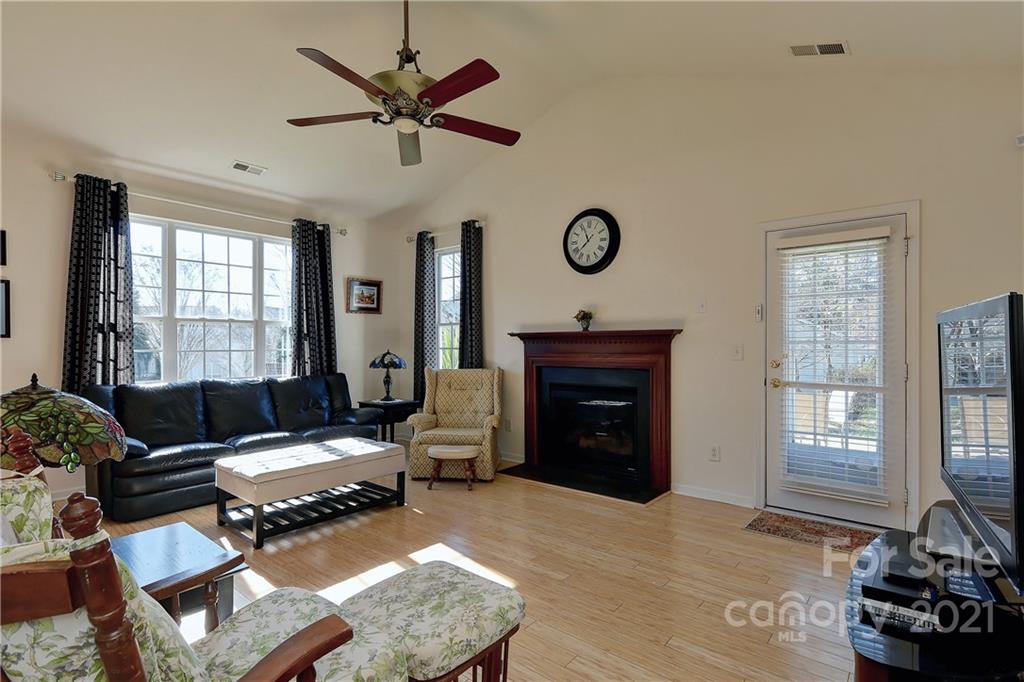 302 Garnet Court, Unit 522 Fort Mill, SC 29708 - Photo 19 of 45 a living room with furniture a fireplace and a window