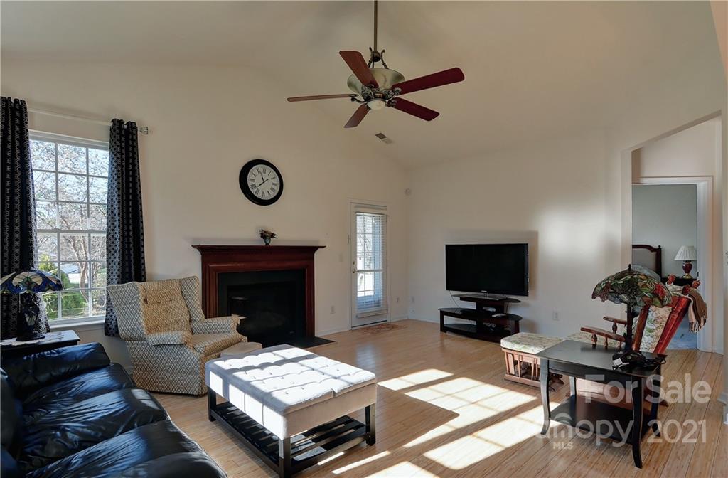 302 Garnet Court, Unit 522 Fort Mill, SC 29708 - Photo 21 of 45 a living room with furniture and a fireplace