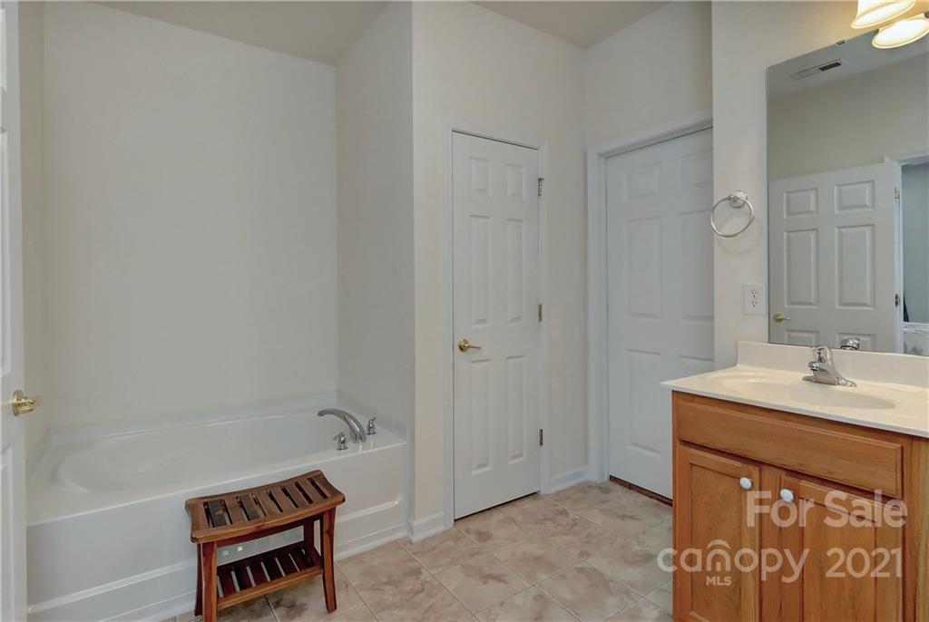 302 Garnet Court, Unit 522 Fort Mill, SC 29708 - Photo 25 of 45 a bathroom with a sink and a mirror