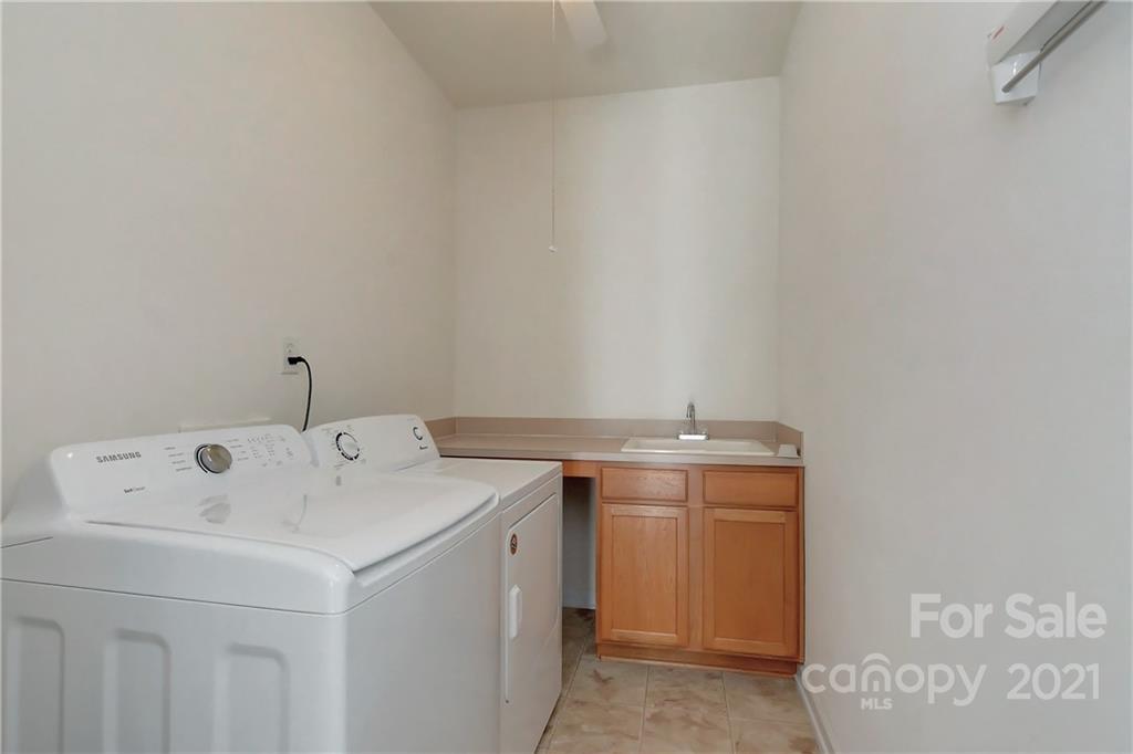 302 Garnet Court, Unit 522 Fort Mill, SC 29708 - Photo 32 of 45 a utility room with dryer and washer