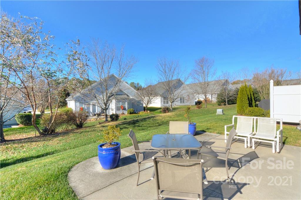 302 Garnet Court, Unit 522 Fort Mill, SC 29708 - Photo 33 of 45 a view of a patio with couches chairs and a fire pit