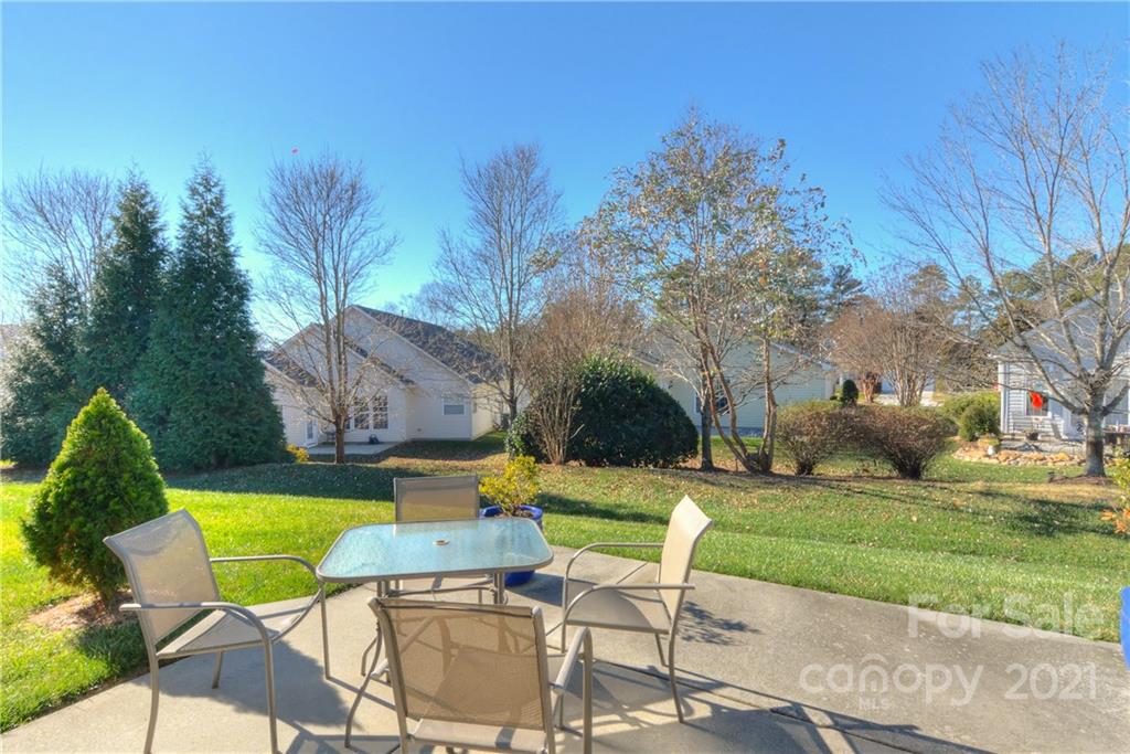 302 Garnet Court, Unit 522 Fort Mill, SC 29708 - Photo 35 of 45 a view of a chair and table in the garden