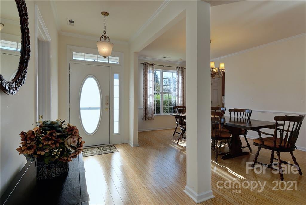 302 Garnet Court, Unit 522 Fort Mill, SC 29708 - Photo 5 of 45 a view of a livingroom with furniture and a chandelier
