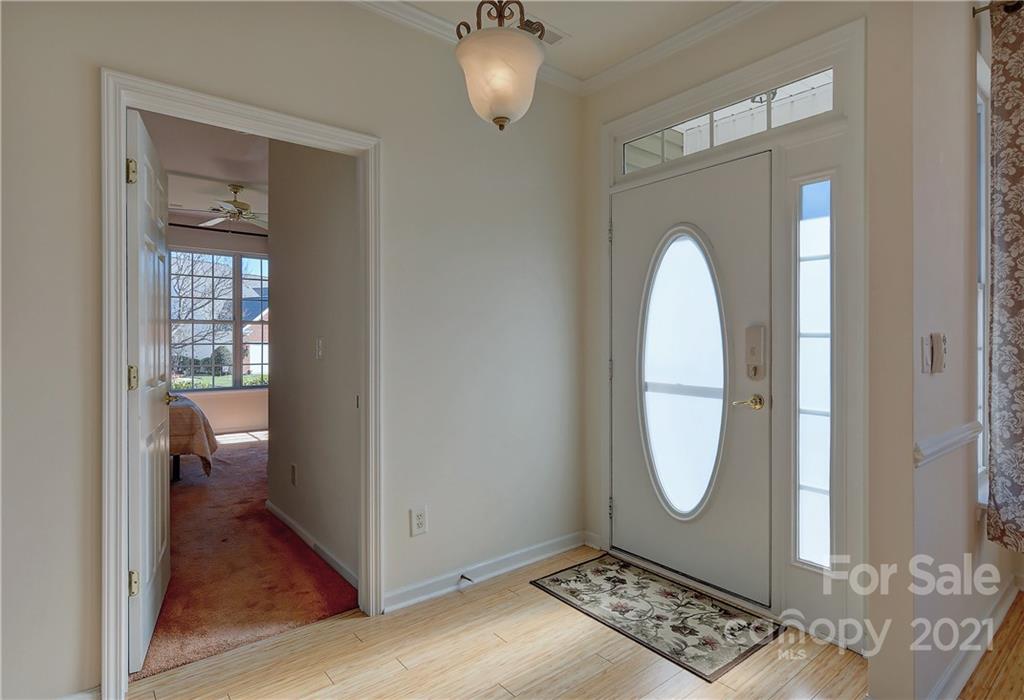 302 Garnet Court, Unit 522 Fort Mill, SC 29708 - Photo 6 of 45 a view of an entryway with wooden floor