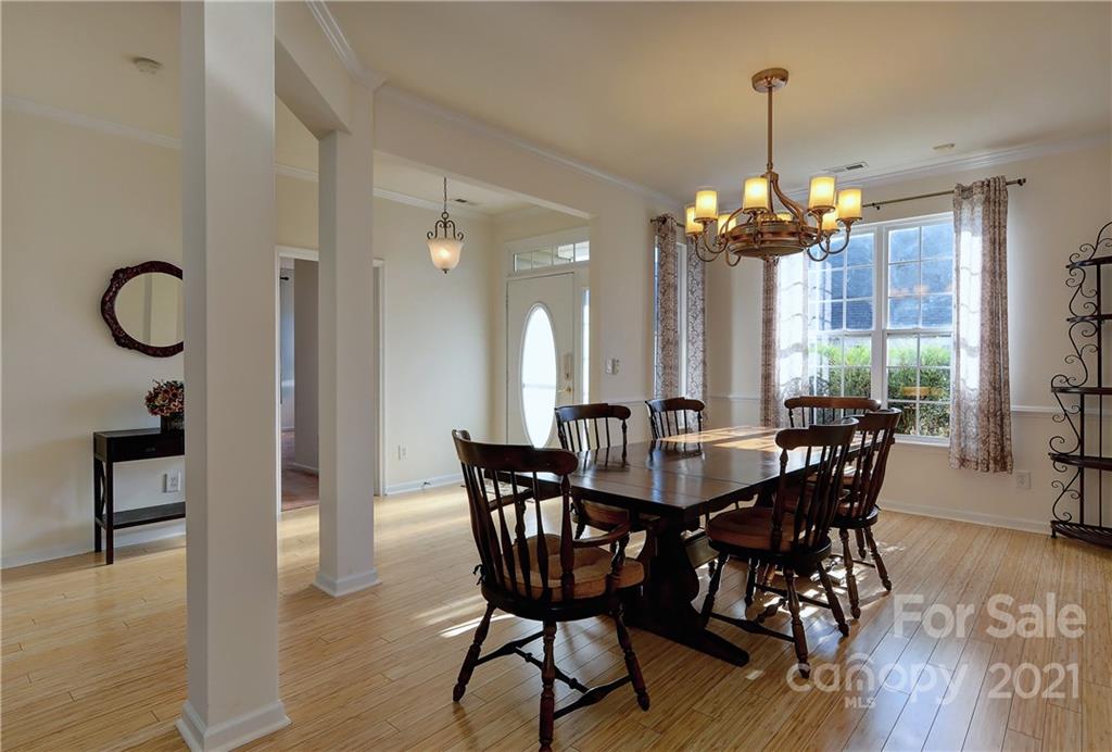 302 Garnet Court, Unit 522 Fort Mill, SC 29708 - Photo 7 of 45 a view of a dining room with furniture window and wooden floor