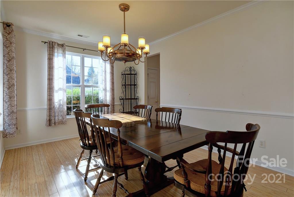 302 Garnet Court, Unit 522 Fort Mill, SC 29708 - Photo 9 of 45 a view of a dining room with furniture window and outside view