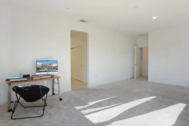 a work room with furniture and a lamp