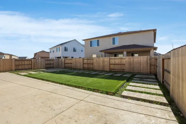 a house view with a garden space
