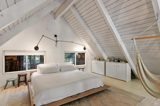 a living room with furniture fireplace and window