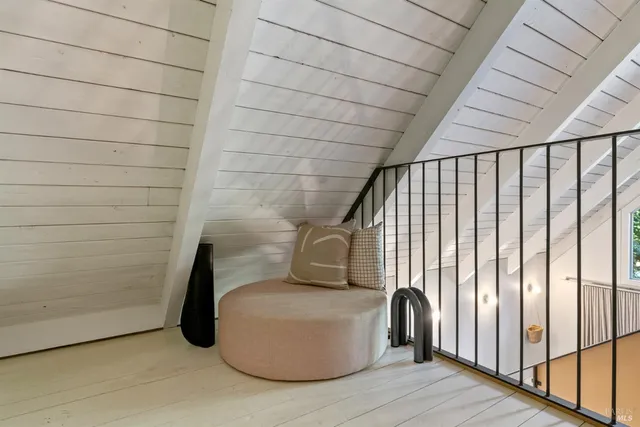 a bedroom with a large bed and a large window