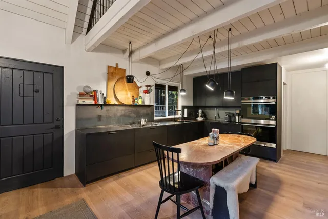 a kitchen with a stove and a kitchen island